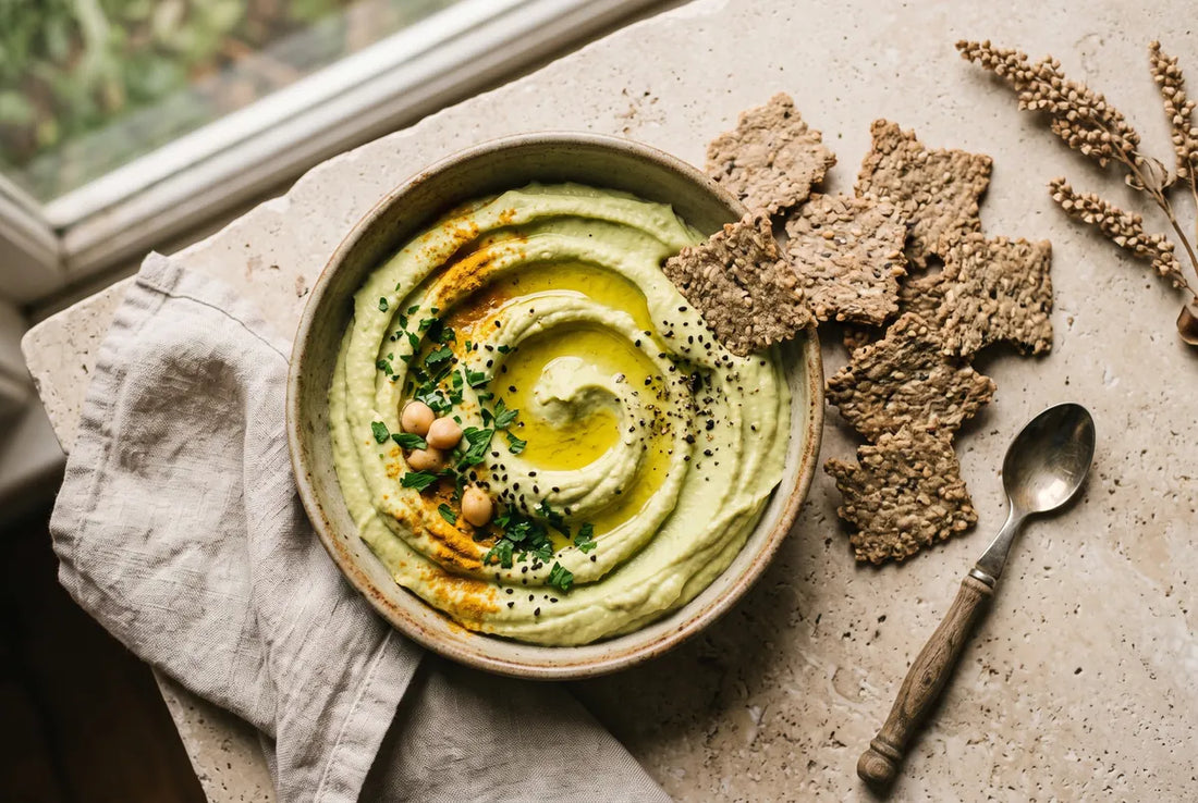 Avocado hummus whipped with chickpeas, tahini and turmeric.
