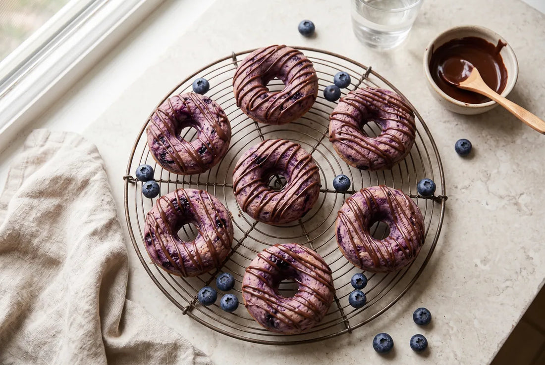 Three-ingredient blueberry donuts made with strained yogurt and almond flour.