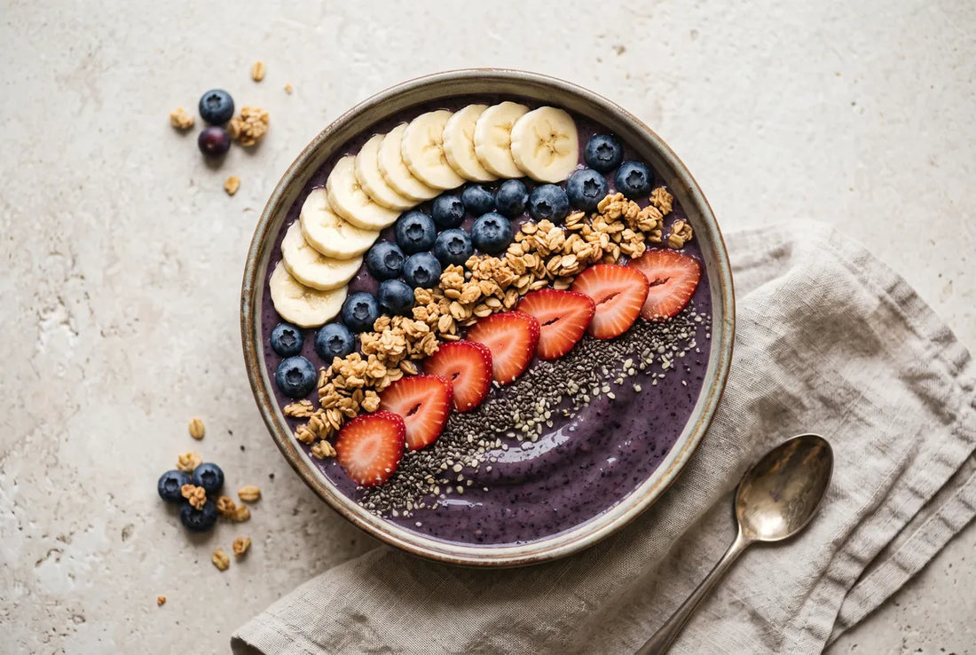 Probiotic kombucha smoothie bowl with blueberries, banana and toppings.