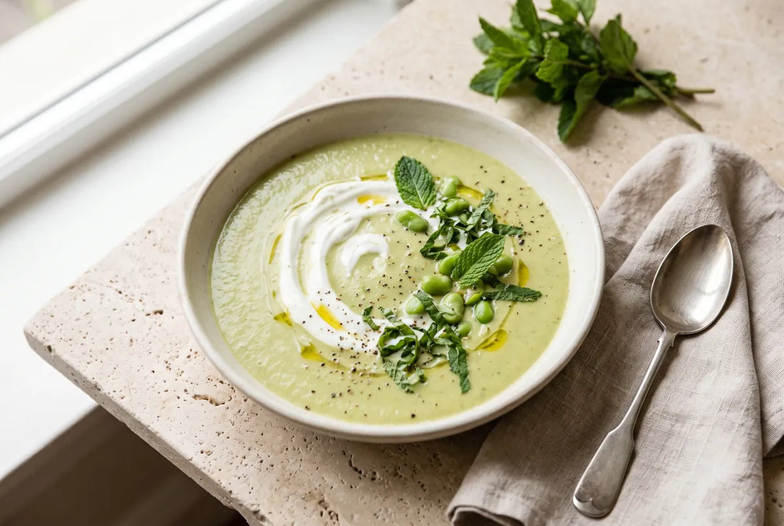 Chilled pea and mint soup, light and protein-rich, in a shallow bowl.