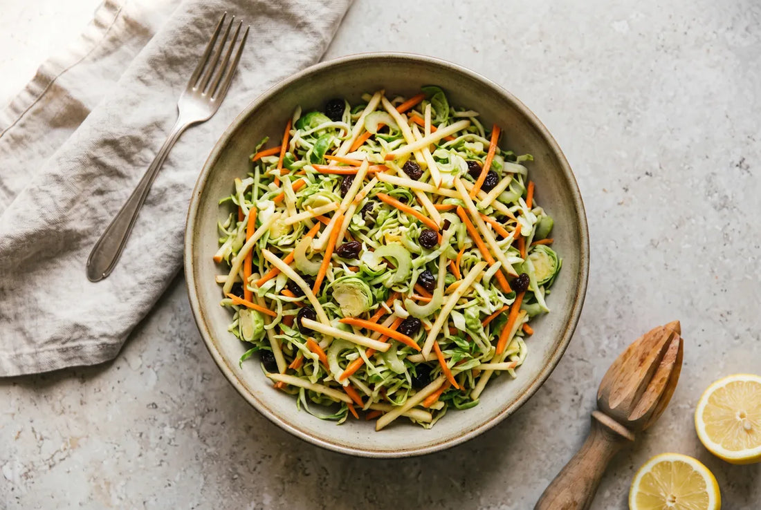 Raw slaw of Brussels sprouts, carrot, apple and celery with lemon and raisins.