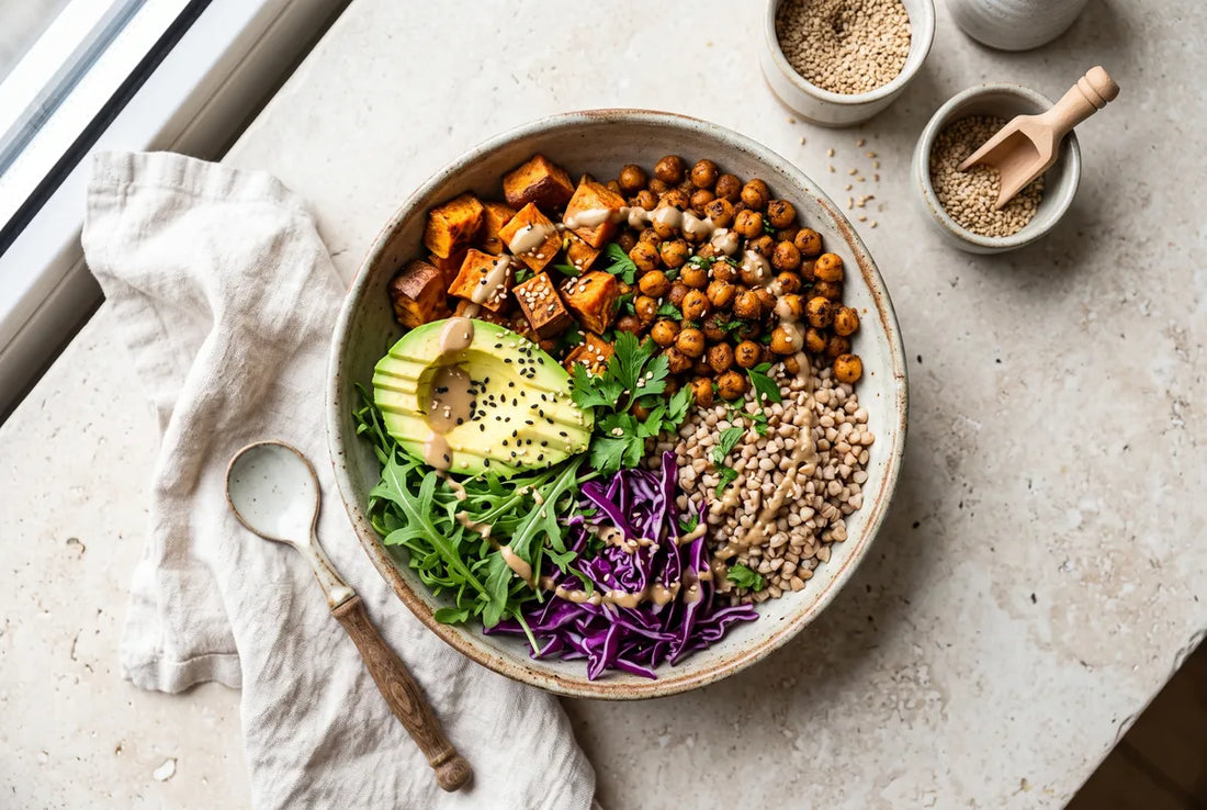 Vegan bowl of crispy chickpeas, sweet potato, buckwheat, avocado and red cabbage.