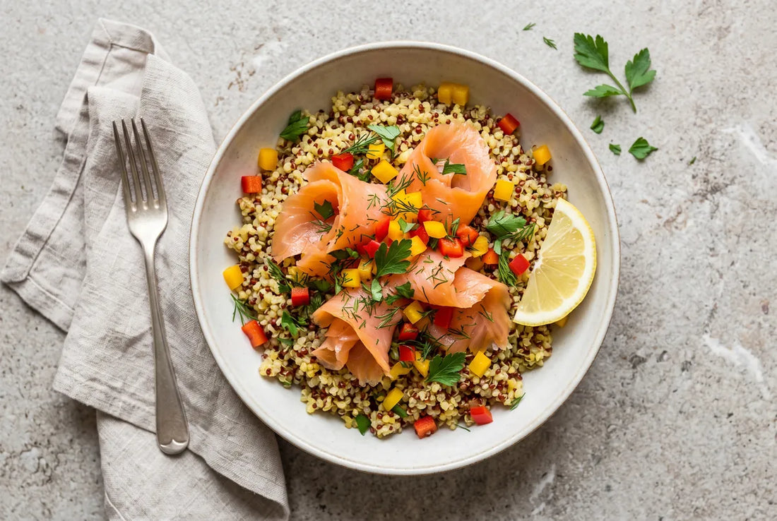 Fluffy quinoa topped with smoked salmon, peppers and fresh herbs.